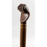 A carved wooden walking cane,