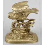 A 19th century gilt bronze ornament modelled as a bird with outstretched wings and open beak,