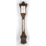 A 19th century carved oak cased stick barometer,
