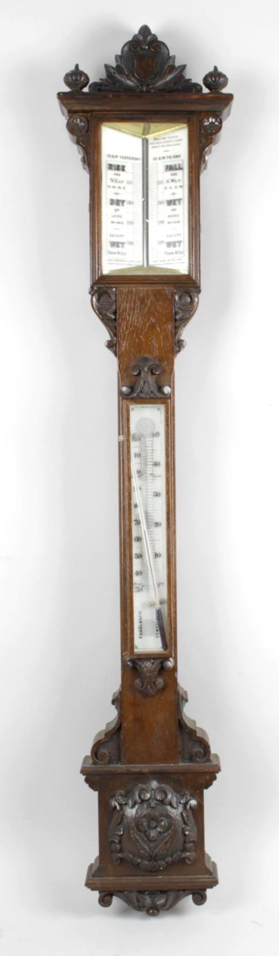 A 19th century carved oak cased stick barometer,