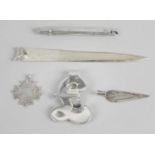 A small selection of novelty items to include a modern silver bookmark with fox head terminal,