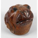 An early 19th century carved fruit wood snuff box,