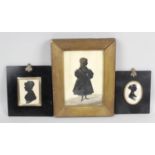 A 19th century cut paper and painted silhouette full length portrait study,