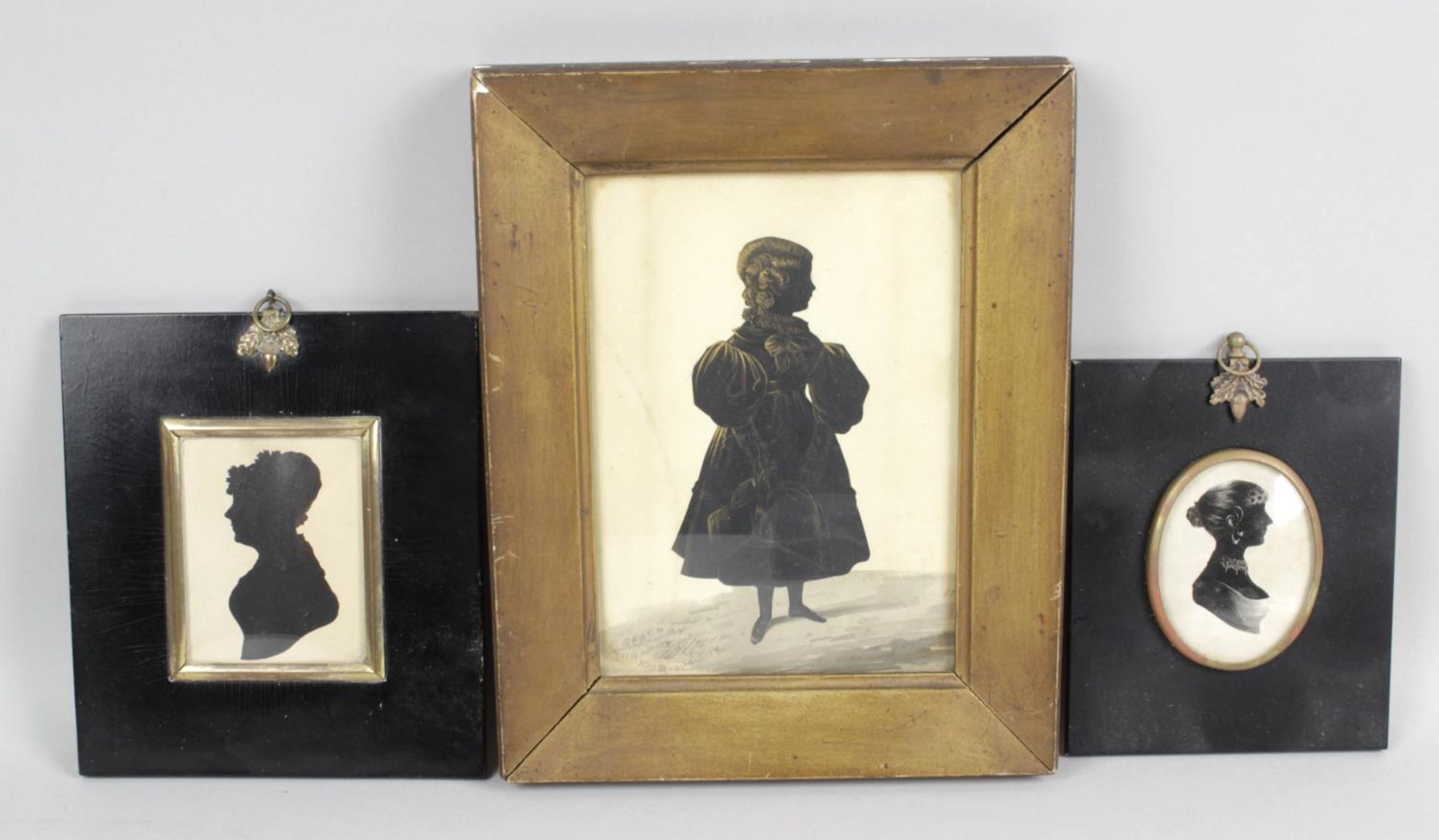 A 19th century cut paper and painted silhouette full length portrait study,