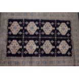 A 20th century machine woven wool work rug,