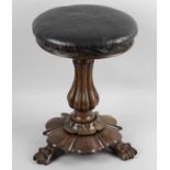 A 19th century carved rosewood piano stool,