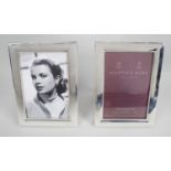 A pair of modern silver mounted photograph frames,