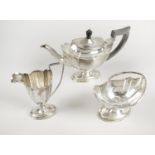A late Victorian silver matched bachelor three piece tea service,