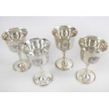 A set of four small silver goblets commemorating the Silver Jubilee,