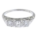 An old-cut diamond three-stone ring.Estimated total diamond weight 0.35ct,