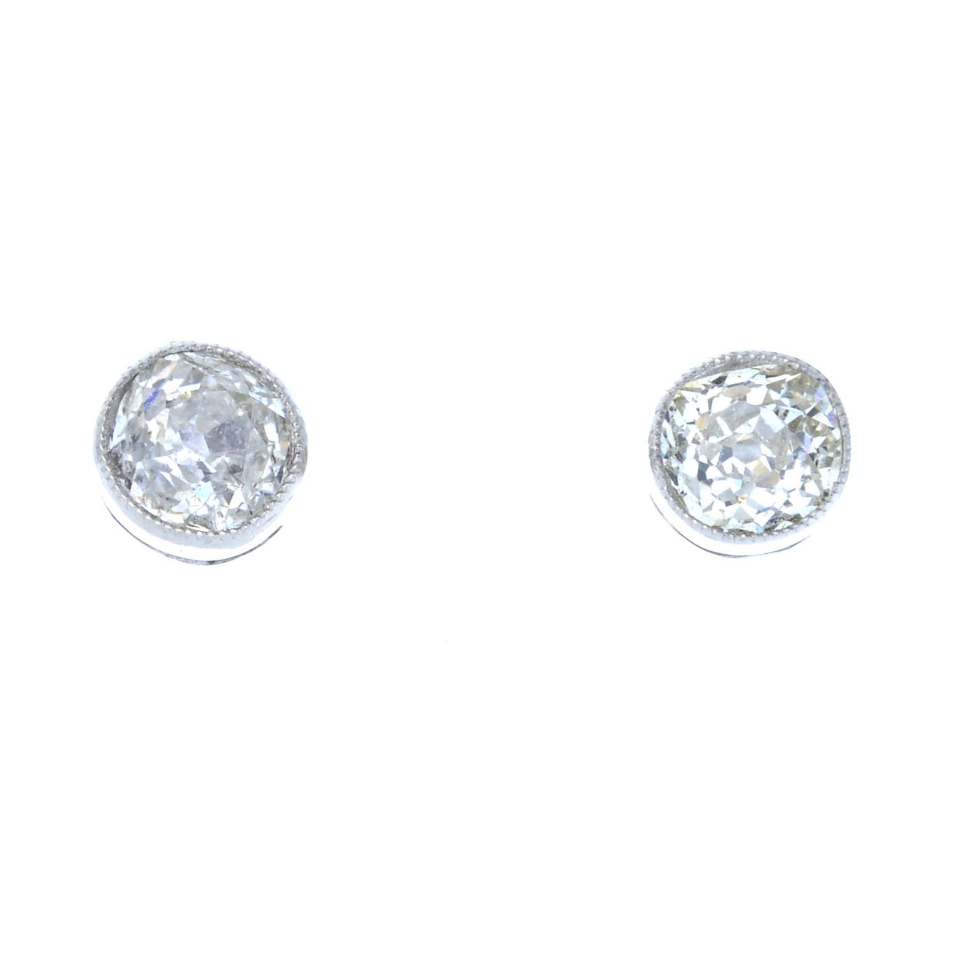 A pair of old-cut diamond stud earrings.Estimated total diamond weight 0.80ct,