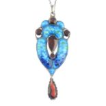 A garnet and enamel pendant, with chain.Length of pendant 6.5cms.