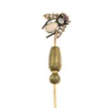 An early 20th century gold opal, diamond and ruby bee stickpin.Length of stickpin head 1.3cms.