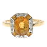 A 9ct gold citrine and diamond ring.Estimated total diamond weight under 0.10ct.Hallmarks for