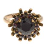 A garnet cluster ring.Ring size L.