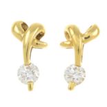 A pair of 18ct gold diamond earrings.Estimated total diamond weight under 0.10ct.Hallmarks for