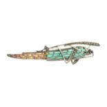 A plique-a-jour enamel grasshopper brooch, with ruby and pyrite detail.