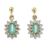 A pair of emerald and diamond cluster earrings.Estimated total diamond weight 0.25ct.Stamped