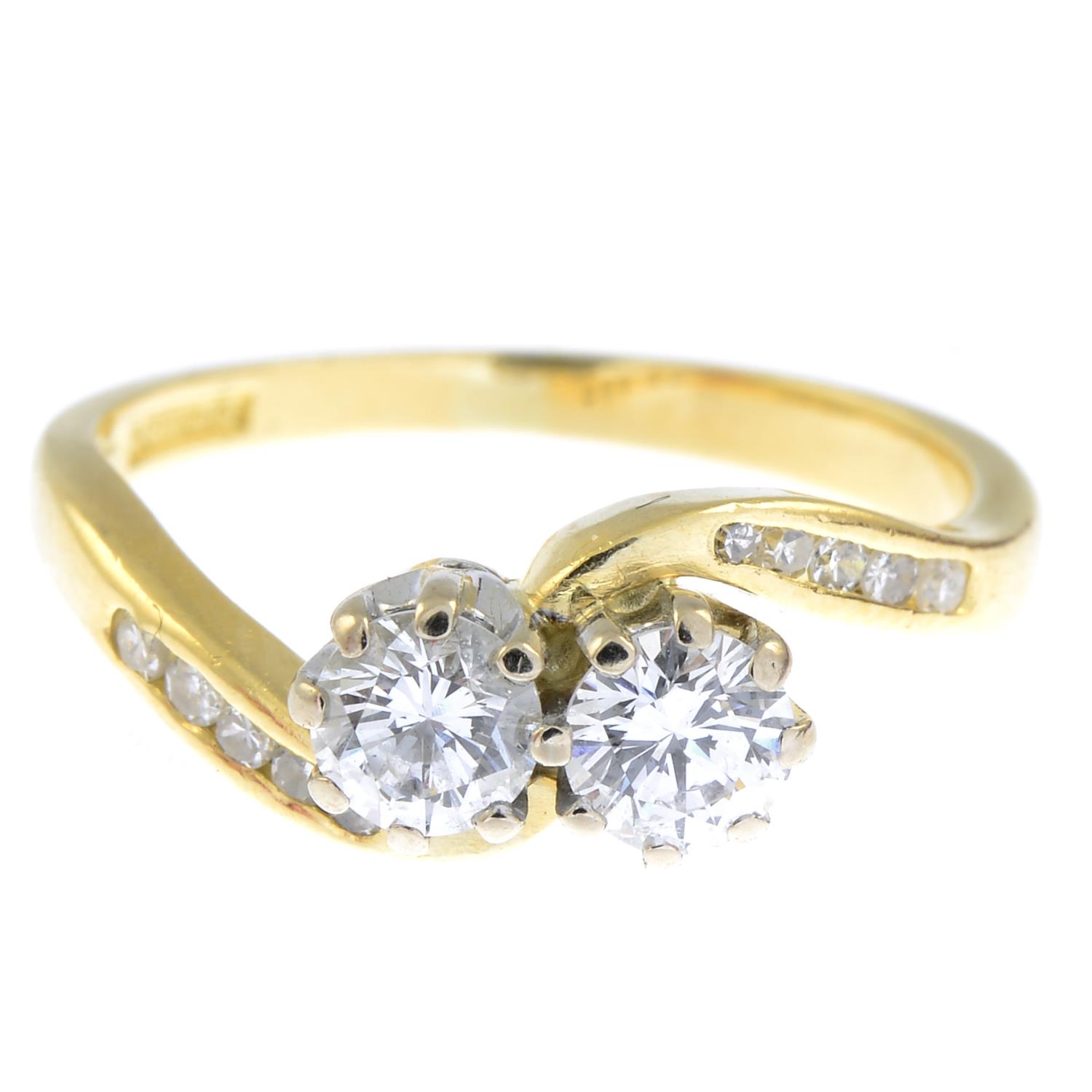 An 18ct gold diamond crossover ring.Estimated total diamond weight 0.60ct,