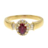A ruby and diamond cluster ring.Ruby weight 0.58ct.Total diamond weight 0.30ct.Stamped 18k.Ring