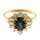 A sapphire and diamond cluster ring.Estimated total diamond weight 0.55ct.