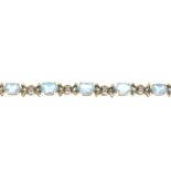 A 9ct gold topaz and single-cut diamond bracelet.Estimated total diamond weight 0.10ct.Import marks