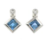 A pair of 18ct gold blue topaz and diamond earrings.Hallmarks for Sheffield, 2006.Length 1cm.