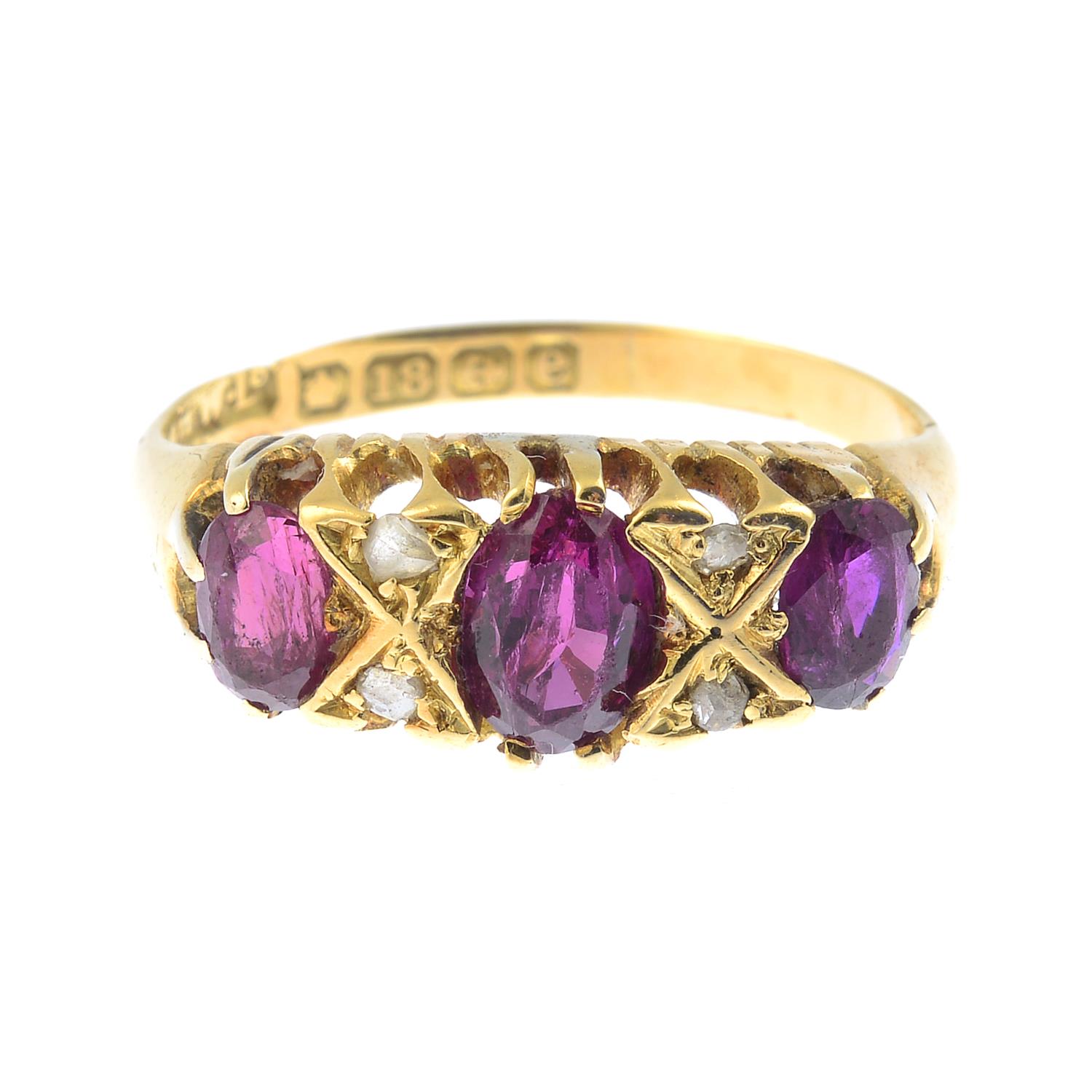 A ruby and diamond dress ring, with 18ct gold replacement band.Band with hallmarks for 18ct gold.