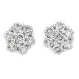 A pair of diamond floral cluster earrings.