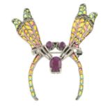 A ruby, pyrite and plique-a-jour enamel brooch, depicting two dragonflies mating.