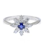 A sapphire and brilliant-cut diamond floral cluster ring.Total diamond weight stamped 0.35ct,