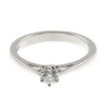 An 18ct gold diamond single-stone ring.Estimated diamond weight 0.20ct,