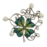 An enamel four-leaf clover brooch, with cutlured pearl highlights.