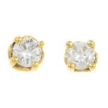 A pair of 18ct gold diamond earrings.Estimated total diamond weight 0.30ct,