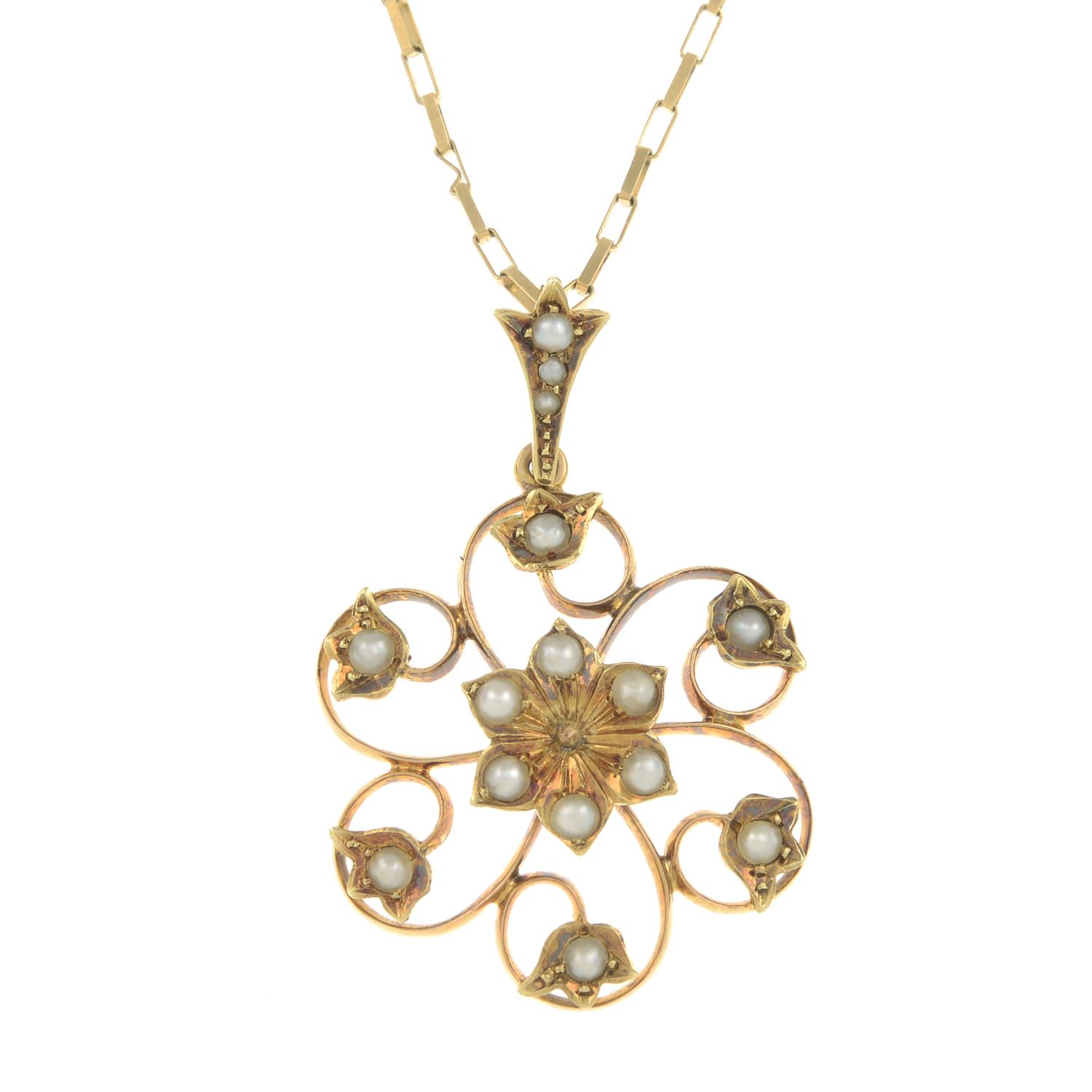 An early 20th century gold split pearl floral pendant,