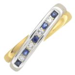 An 18ct bi-colour gold sapphire and diamond bi-colour ring.Estimated total diamond weight