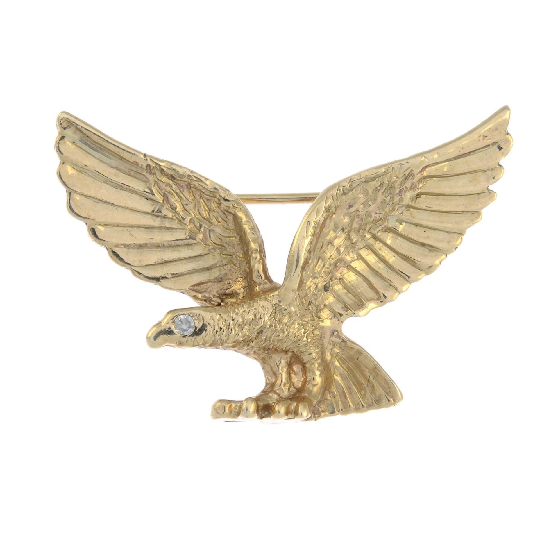 An eagle brooch, with colourless gem accent eye.