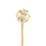 An early 20th century gold old-cut yellow diamond stickpin.