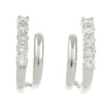 A pair of 18ct gold diamond earrings.Estimated total diamond weight 0.30ct,