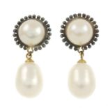 A pair of freshwater cultured pearl earrings.Freshwater cultured pearls measuring 10.6 and 10.1mms.