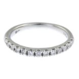 A platinum brilliant-cut diamond half eternity ring.