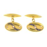 A pair of early 20th century gold rose-cut diamond and sapphire cufflinks.Length of cufflink head