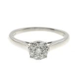 A diamond cluster ring.Estimated total diamond weight 0.30ct,