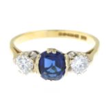 An 18ct gold blue paste and brilliant-cut diamond three-stone ring.Estimated total diamond weight