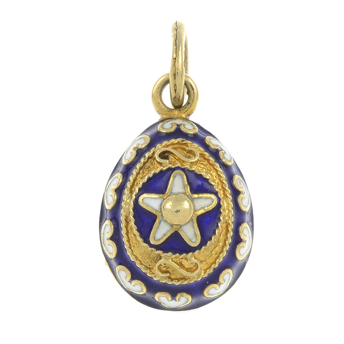 A blue and white enamel egg pendant.Surmount stamped 585.