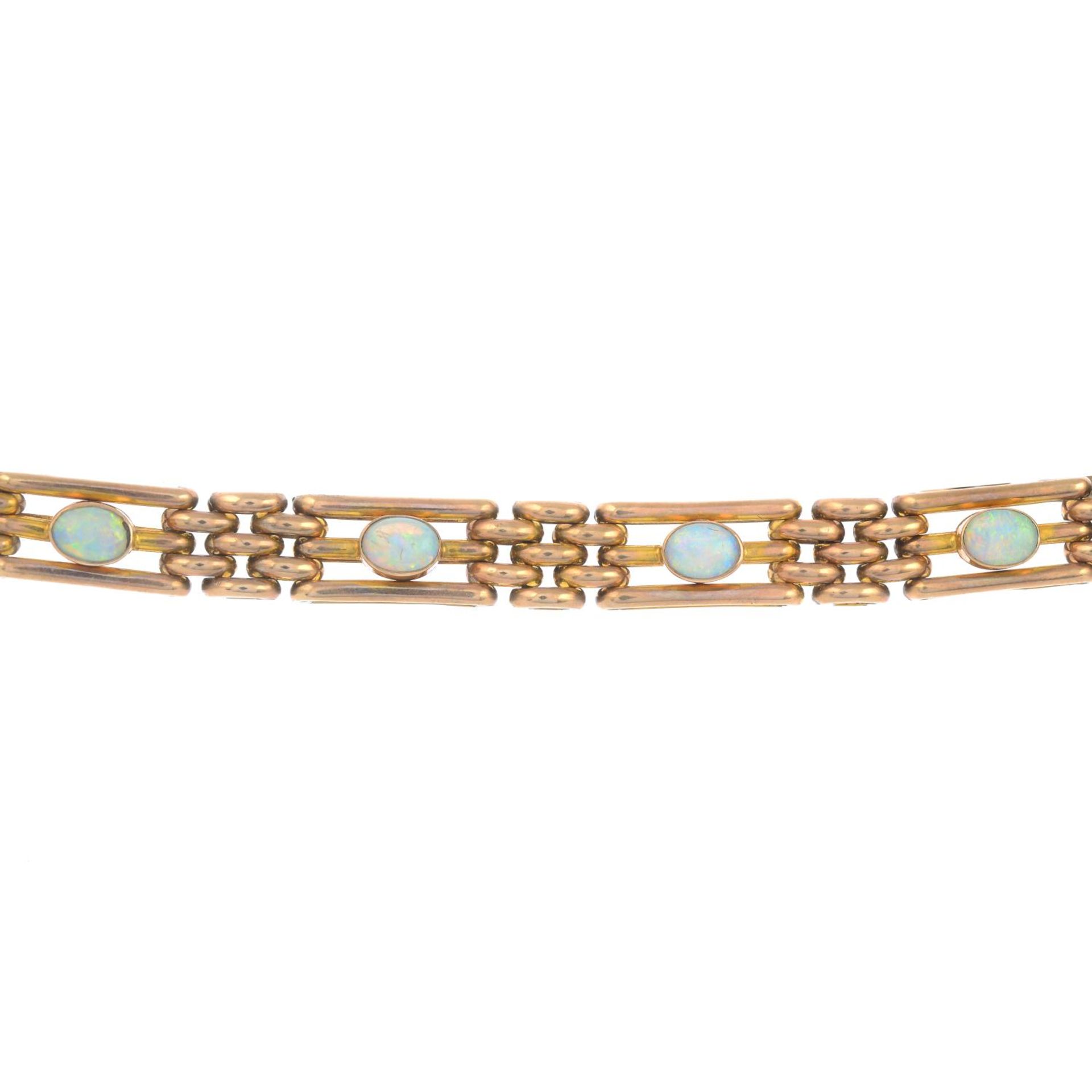 An early 20th century 9ct gold opal brick-link bracelet.