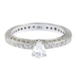 A pear-shape diamond single-stone ring, with pave-set diamond band.