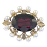 A 9ct gold garnet and cultured pearl brooch.Hallmarks for London, 1971.Length 3.3cms.