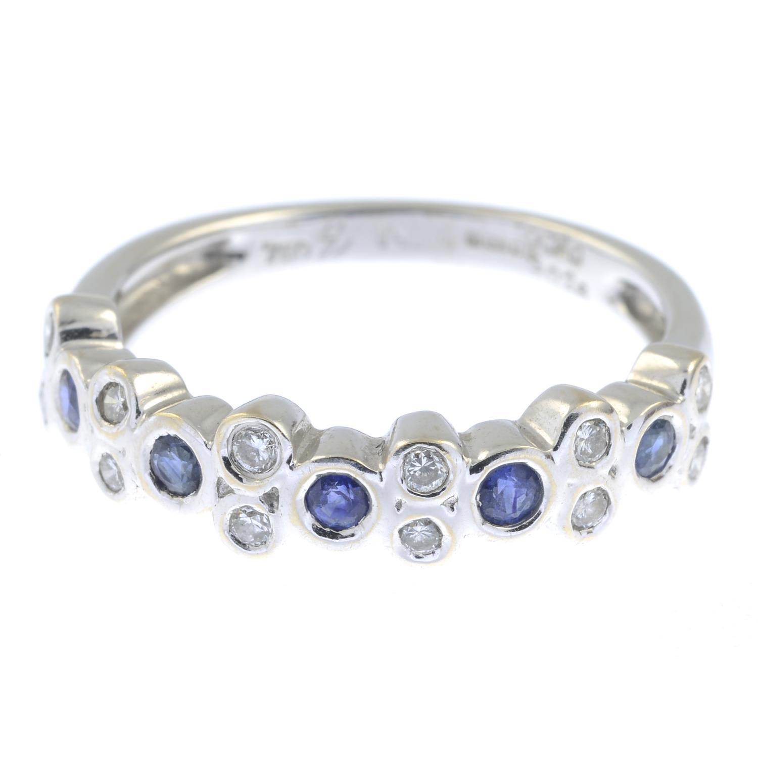 An 18ct gold sapphire and diamond ring.Estimated total diamond weight 0.20ct.Hallmarks for London,