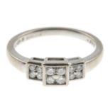 An 18ct gold diamond ring.Total diamond weight 0.25ct, stamped to band.